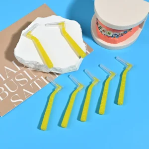 L-type interdental brushes with ergonomic angled handles in assorted colors, designed for professional oral care cleaning between teeth, ideal for B2B dental suppliers and OEM manufacturing.