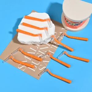 L-type interdental brushes with ergonomic angled handles in assorted colors, designed for professional oral care cleaning between teeth, ideal for B2B dental suppliers and OEM manufacturing.