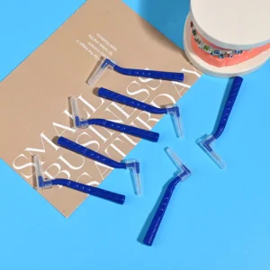 L-type interdental brushes with ergonomic angled handles in assorted colors, designed for professional oral care cleaning between teeth, ideal for B2B dental suppliers and OEM manufacturing.