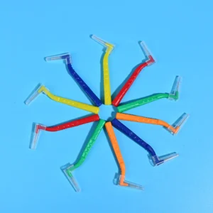 L-type interdental brushes with ergonomic angled handles in assorted colors, designed for professional oral care cleaning between teeth, ideal for B2B dental suppliers and OEM manufacturing.
