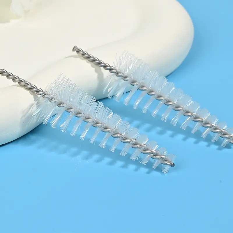 Medical device cleaning brush head with durable nylon bristles and twisted stainless steel wire, designed for effective cleaning of lumens, tubes, and narrow channels for B2B medical and OEM applications.