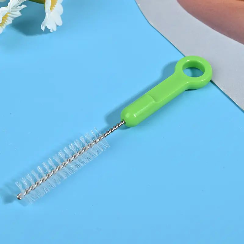 Medical device cleaning brush with stainless steel twisted wire and nylon bristles, featuring an ergonomic green handle for precise cleaning of tubes and medical instruments, suitable for B2B wholesale supply.