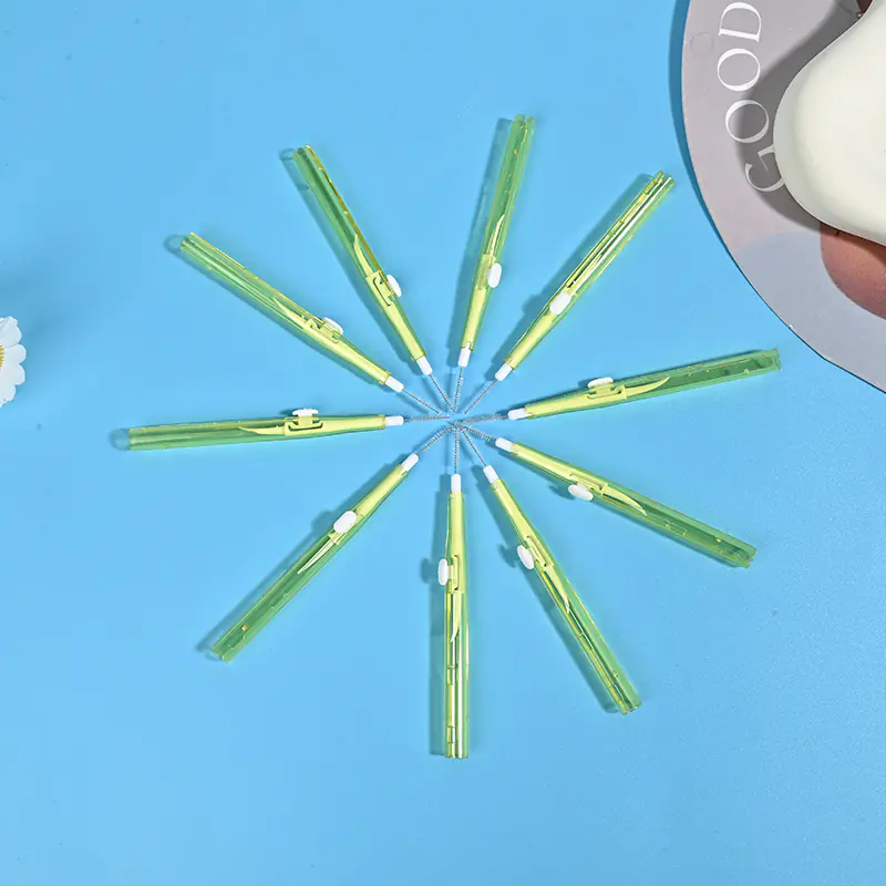 Push-pull type interdental brushes with yellow transparent handles, compact sliding design for easy storage and hygiene, suitable for dental care brands and B2B wholesale supply.