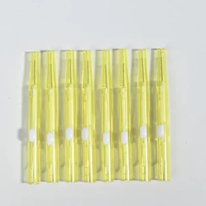 Push-pull type interdental brushes with yellow transparent handles, compact sliding design for easy storage and hygiene, suitable for dental care brands and B2B wholesale supply.