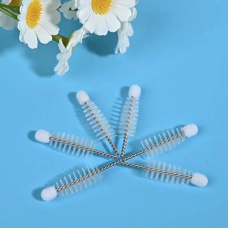 Mascara brush heads with twisted stainless steel wire and soft nylon bristles for cosmetic manufacturing