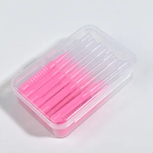 I-Type interdental brushes in multiple colors (pink, blue, red) with straight handles and tapered bristles, organized in a reusable storage box