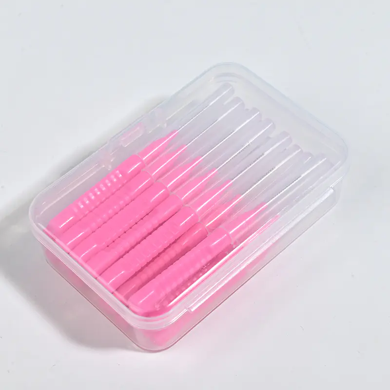 I-Type interdental brushes in multiple colors (pink, blue, red) with straight handles and tapered bristles, organized in a reusable storage box