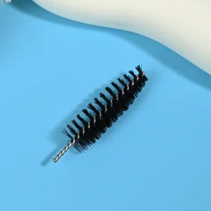 Black mascara brush heads with dense spiral bristles and twisted metal wire core, designed for professional eyelash application, OEM manufacturing, and bulk B2B cosmetic supply.