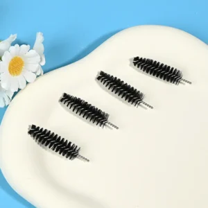 Black mascara brush heads with dense spiral bristles and twisted metal wire core, designed for professional eyelash application, OEM manufacturing, and bulk B2B cosmetic supply.
