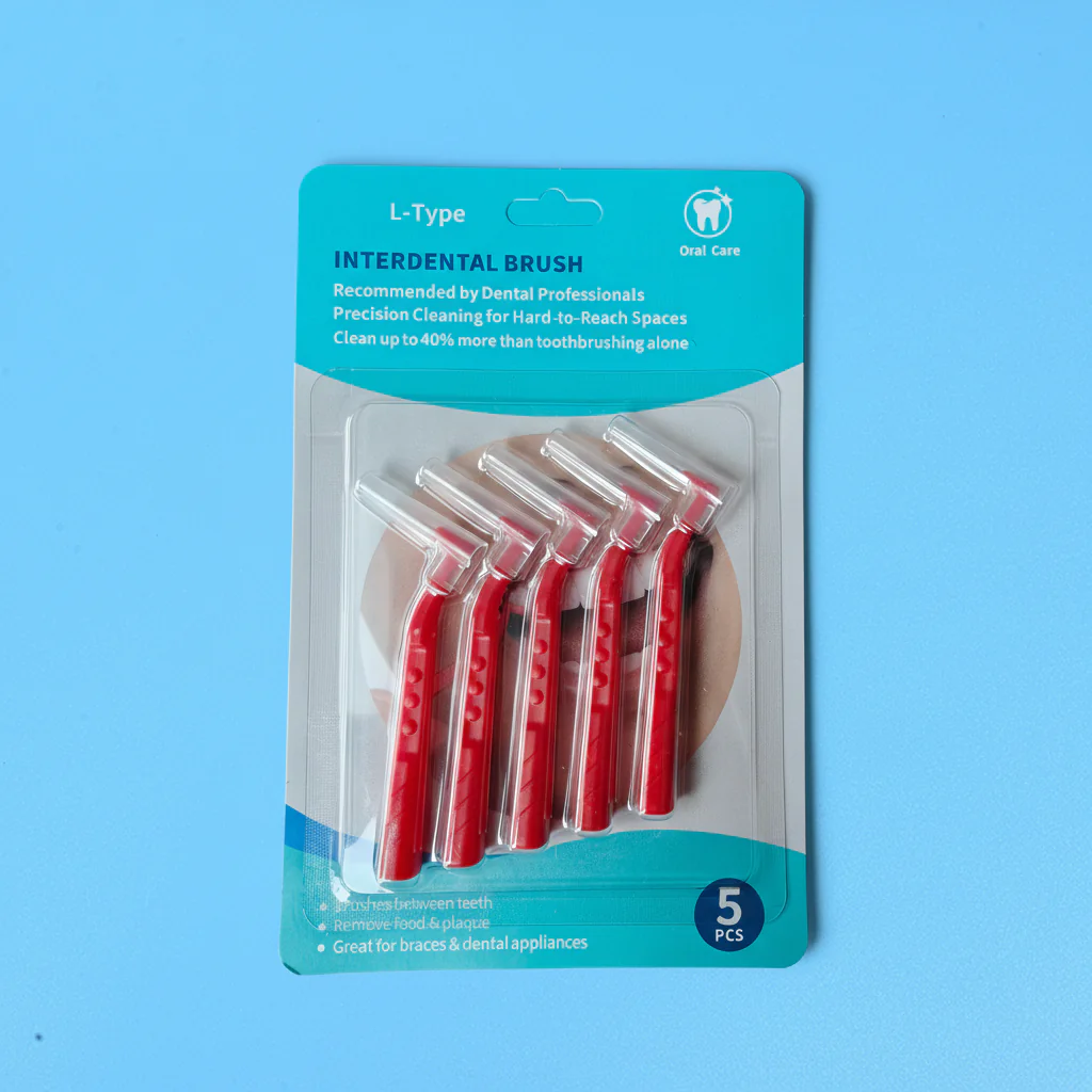 L-shaped interdental brushes in blister packaging with ergonomic angled handles and protective caps, ideal for dental cleaning, OEM supply, and B2B wholesale oral care products