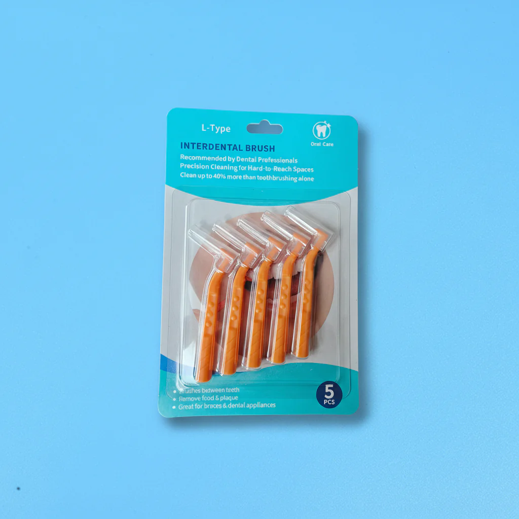 L-shaped interdental brushes in blister packaging with ergonomic angled handles and protective caps, ideal for dental cleaning, OEM supply, and B2B wholesale oral care products