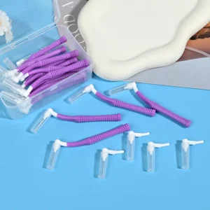 open clear box of purple L-type interdental brushes with loose samples