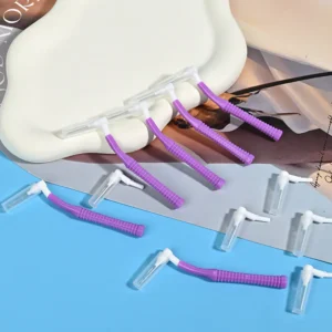 close-up of single purple L-type interdental brushes with protective caps