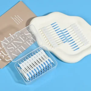 open clear box of blue silicone interdental brushes with loose samples