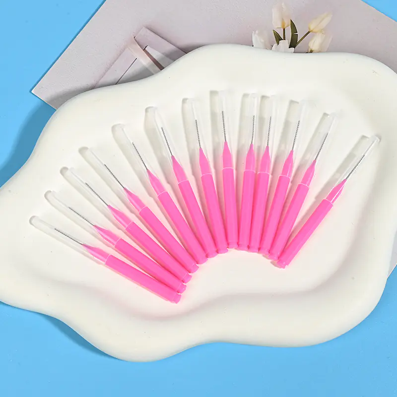 fan-arranged-disposable-interdental-brushes.jpg Disposable pink interdental brushes with protective caps - bulk pack for clinics, dental practices, and oral care distributors