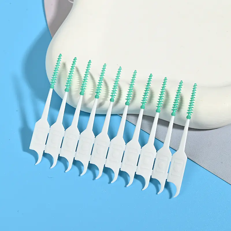 green-silicone-interdental-brushes-closeup-display.jpg close-up of green silicone interdental brushes arranged in a row
