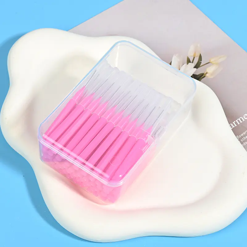 pink-interdental-brushes-storage-box.jpg Clear plastic storage box of pink interdental brushes - bulk pack with protective caps for hygienic storage and resale