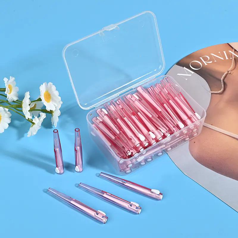 open clear box of retractable pink interdental brushes with sliding mechanism