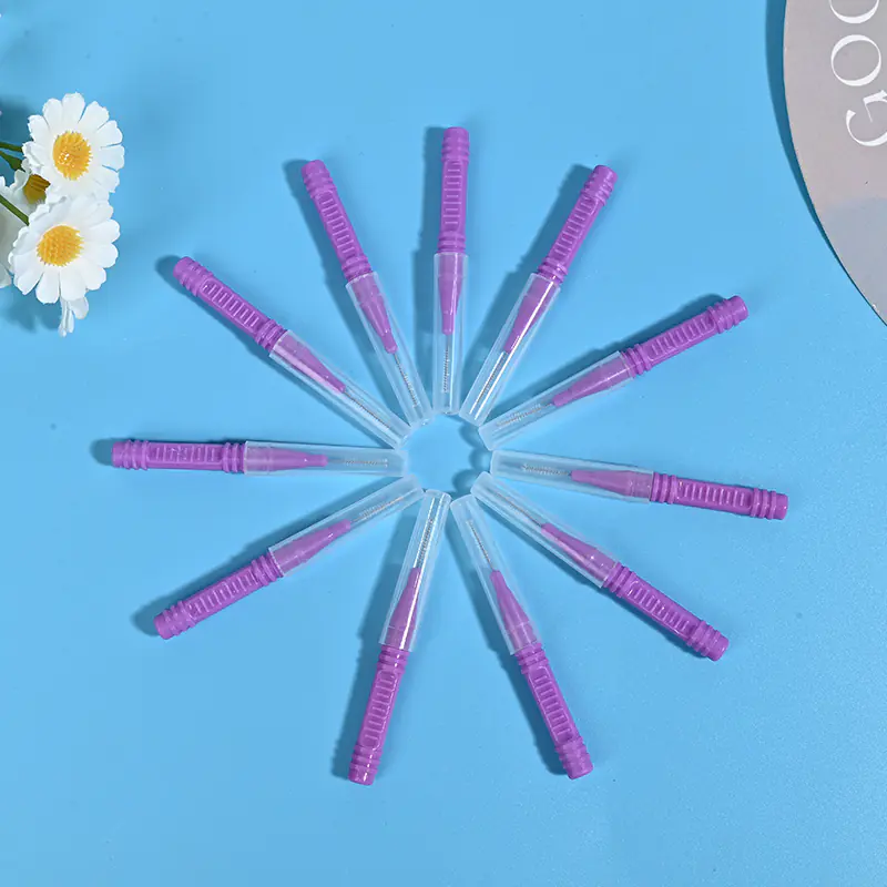Star-shaped arrangement of purple interdental brushes showing bristles and handles for product display