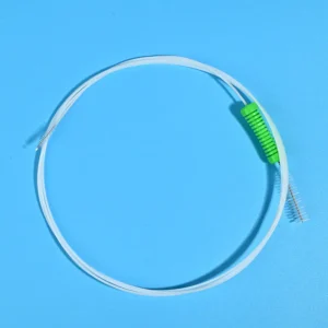 white endoscope cleaning brush with green ergonomic handle