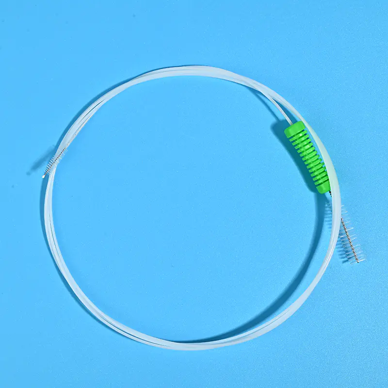 white endoscope cleaning brush with green ergonomic handle