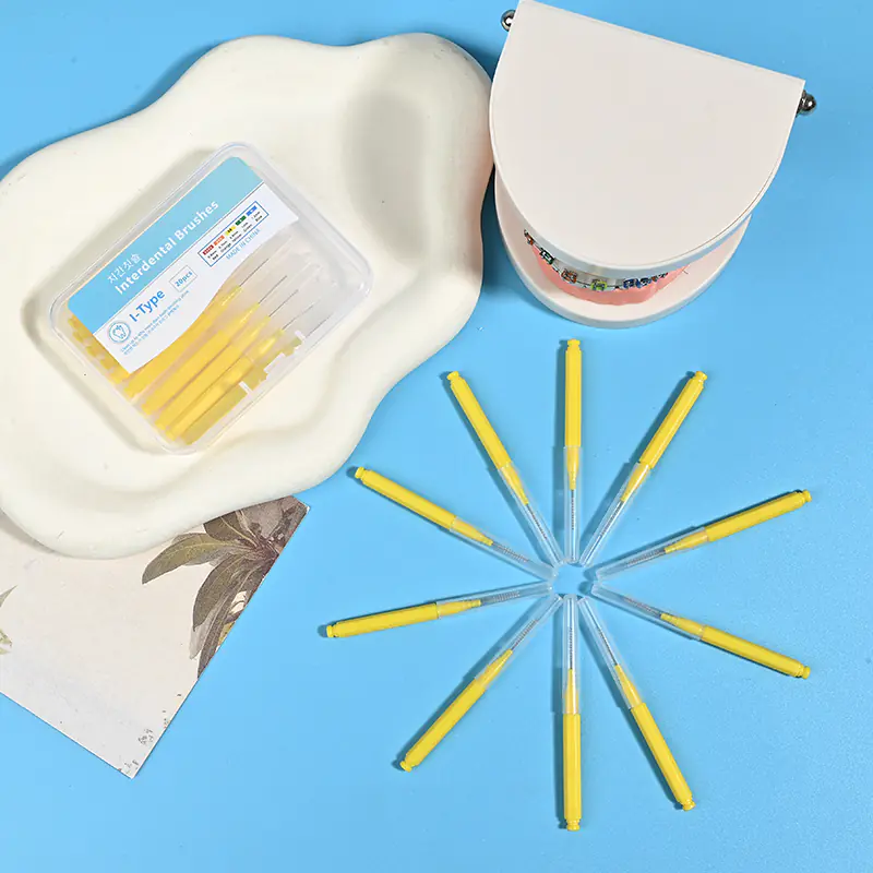 yellow i-type interdental brushes in clear plastic box for orthodontic cleaning