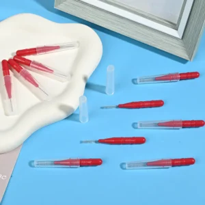 Close up of single tuft interdental brush with conical bristles and red handle, specialized dental cleaning tools for tight spaces, bulk order