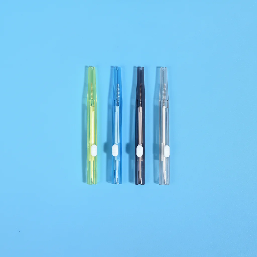 Four assorted translucent color sliding I-type interdental cleaners lined vertically on solid bright blue background