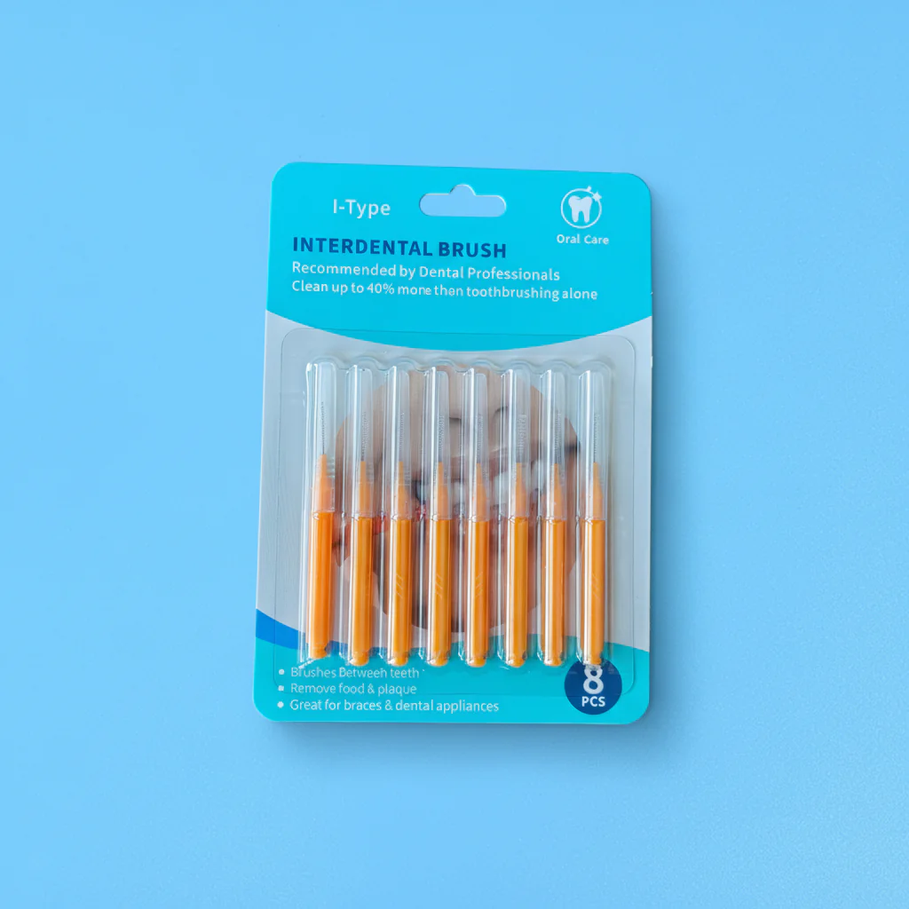 8 pieces orange I-type interdental brushes in blister card packaging on blue background, retail ready dental packs wholesale from Qingdao factory