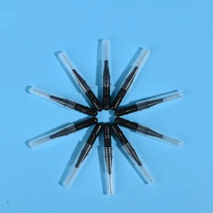 Nine black disposable interdental brushes with transparent protective caps arranged radially on light blue background