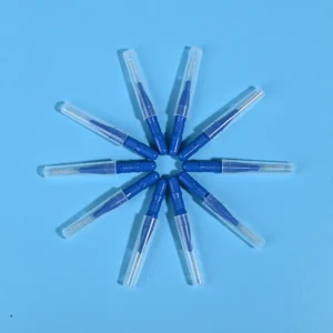 Nine dark blue disposable interdental brushes with transparent protective caps arranged radially on light blue background