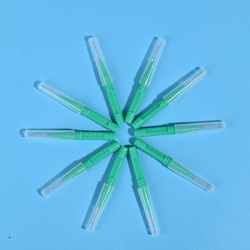 Green I-type interdental brushes with protective caps arranged in star shape, wholesale dental cleaning tools from Qingdao factory