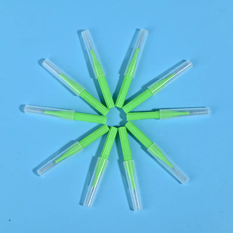 Green I-type interdental brushes with protective caps arranged in star shape, single-size wholesale dental tools from Qingdao manufacturer