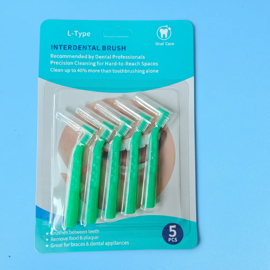 5pcs green fixed L-curved interdental brushes packed in printed English paper blister retail hang card on solid light blue background