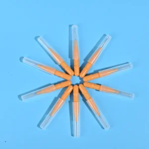 Nine orange disposable interdental brushes with transparent protective caps arranged radially on light blue background