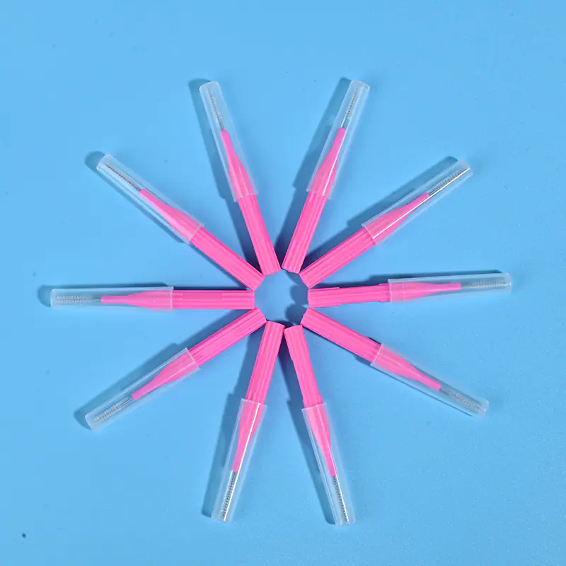 Pink I-type interdental brushes with protective caps arranged in star shape, wholesale dental cleaning tools from Qingdao factory