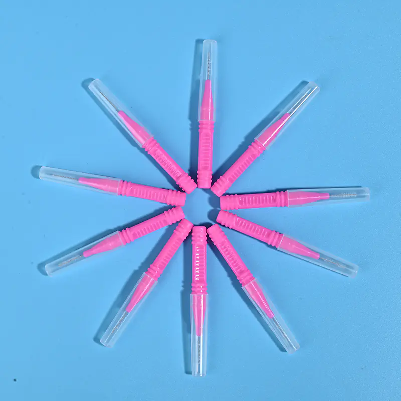 Pink I-type interdental brushes with protective caps arranged in star shape, wholesale dental cleaning tools from Qingdao factory