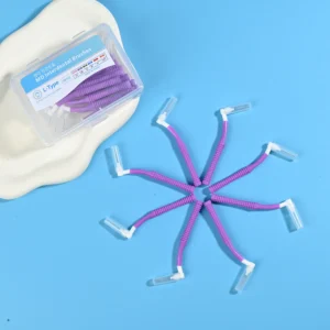 Purple L-type MD interdental cleaners arranged radial star shape with original clear storage box on beige irregular pad and bright blue background