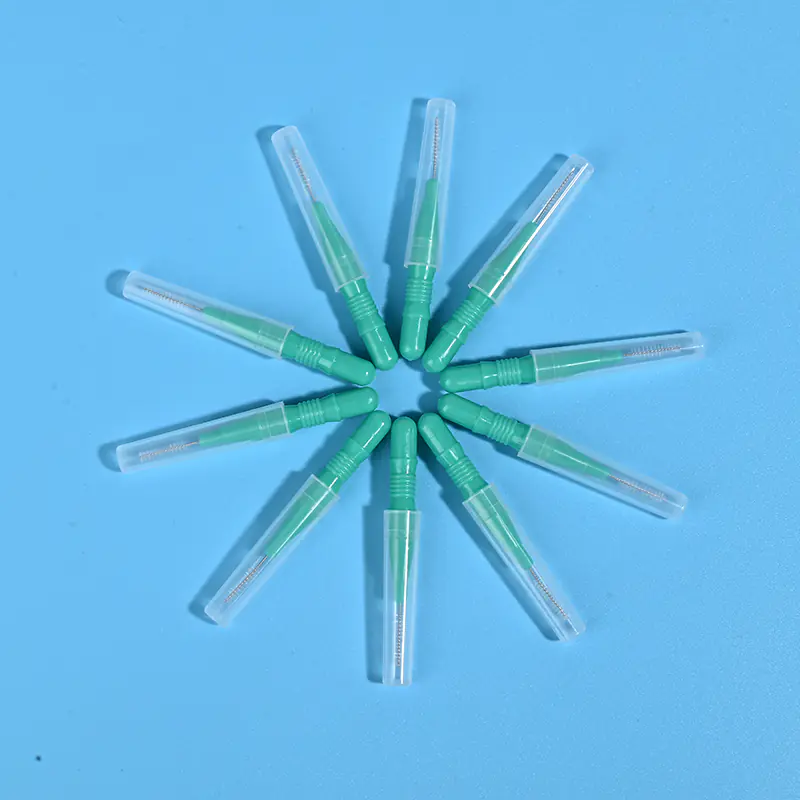 Green I-type interdental brushes with protective caps arranged in star shape, wholesale dental cleaning tools from Qingdao factory