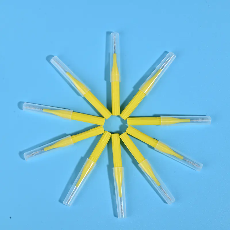Yellow I-type interdental brushes with protective caps arranged in star shape, wholesale dental cleaning tools from Qingdao factory