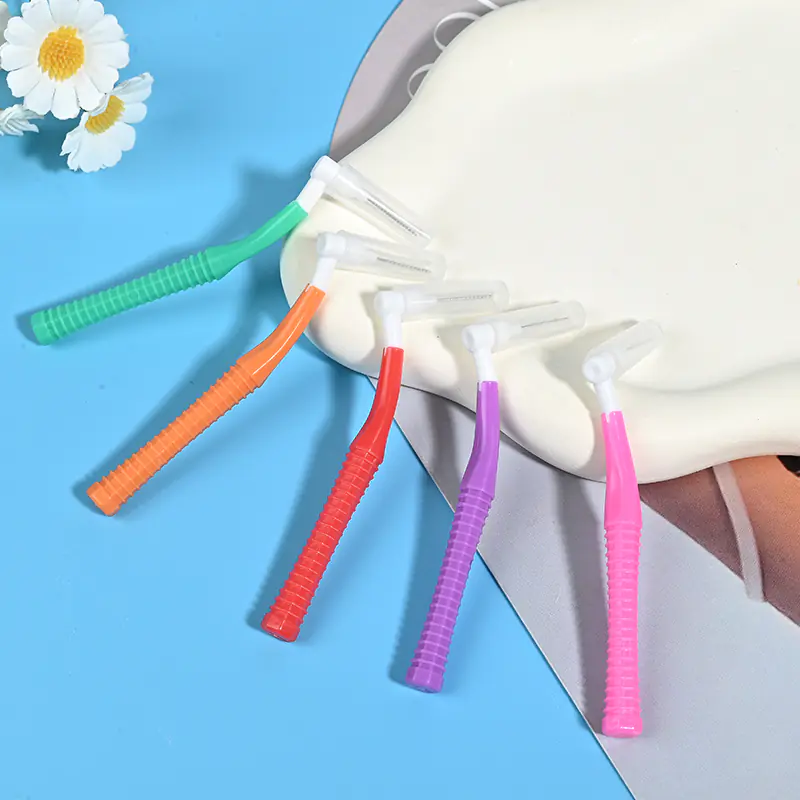 Five assorted color L-type bend handle interdental brushes with protective caps lifestyle scene photo, wholesale oral care supplies