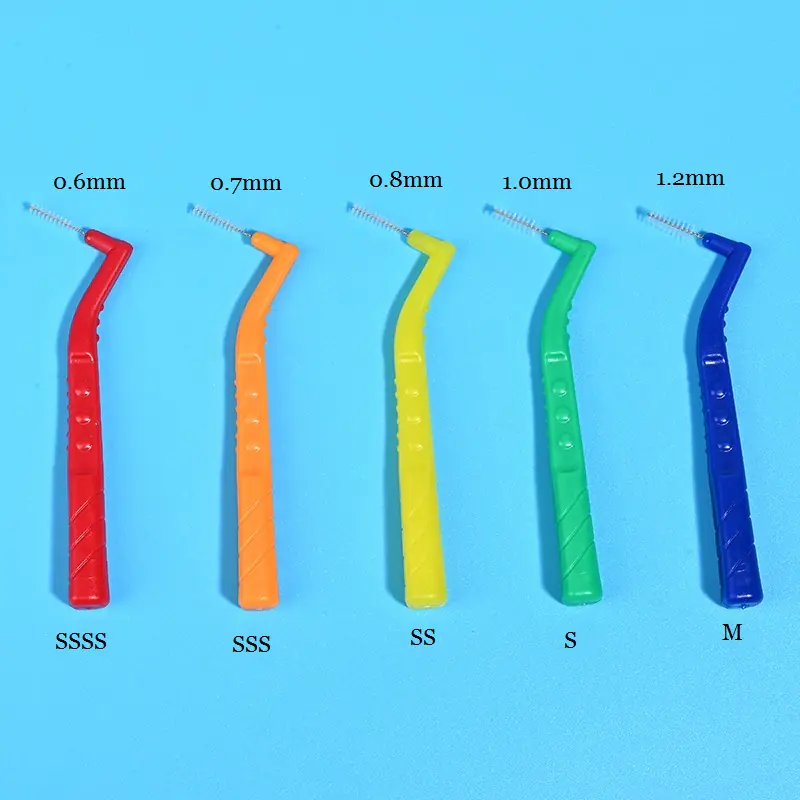 2-full-color-size-comparison-l-type-interdental-brushes-blue-background.jpg Five assorted color L-type interdental brushes size comparison layout marked 0.6mm~1.2mm ISO dimensions and size codes on blue background