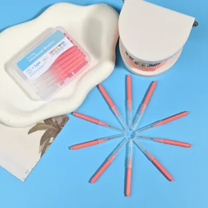 Close-up transparent plastic box filled with pink straight I-type interdental brushes, bilingual Korean English label with full ISO size color chart on solid light blue background