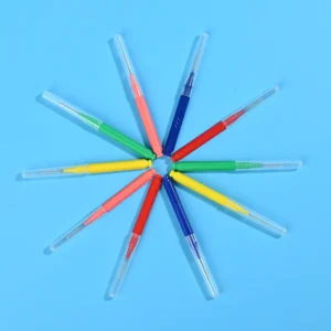 Assorted color I-type interdental brushes with protective caps arranged in star radial shape on blue background, export oral care cleaning tools