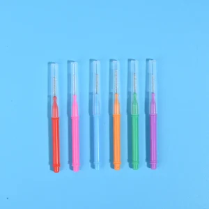 Six assorted color retractable I-type interdental brushes with clear dust protection cap lined vertically on solid bright blue background