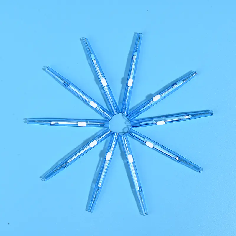 3-transparent-sky-blue-sliding-i-type-interdental-brushes-star-arrangement-blue-bg.jpg Transparent sky blue sliding push I-type interdental brushes arranged radial star layout on solid light blue background