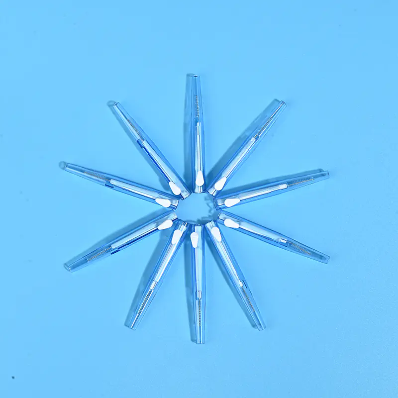 3-transparent-skyblue-sliding-interdental-brushes-star-arrangement-blue-bg.jp Transparent sky blue sliding push I-type interdental brushes arranged radial star layout on solid light blue background