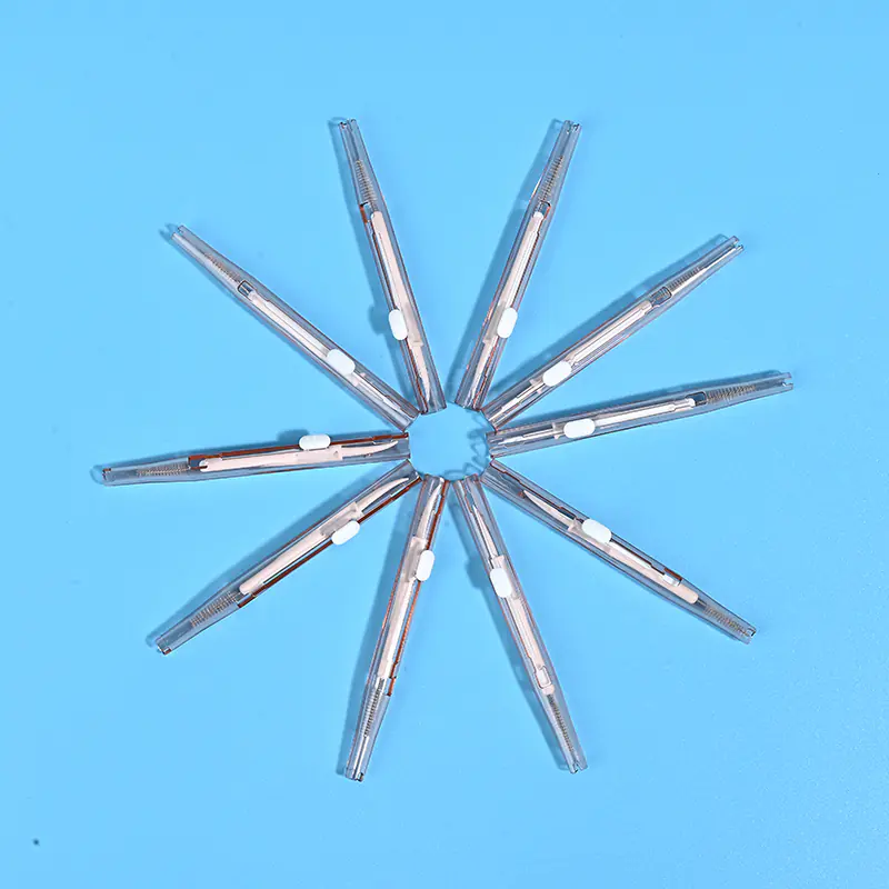 4-clear-transparent-sliding-interdental-brushes-star-layout-blue-background.jpg Full clear transparent sliding I-type interdental brushes arranged radial star shape on solid light blue background