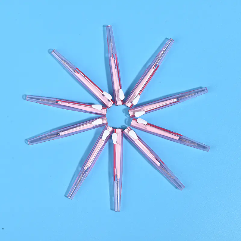4-transparent-pink-sliding-i-type-interdental-brushes-star-layout-blue-bg.jpg Transparent pink sliding retractable interdental brushes arranged radial star shape on solid light blue background