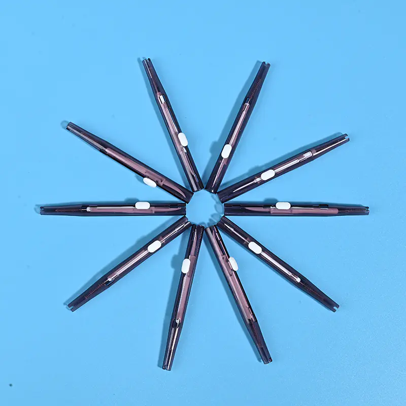 5-smoky-brown-transparent-sliding-interdental-brushes-star-arrangement-blue-bg.jp Smoky dark brown translucent sliding I-type interdental brushes arranged radial star shape on solid light blue background